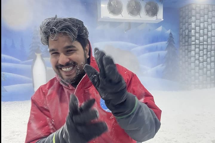 Visitor enjoying the cold snow room